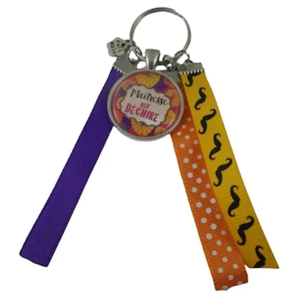 Porte clés violet, orange et jaune "maîtresse qui déchire"