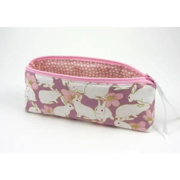 Trousse triangle à fermeture éclair lapins blancs