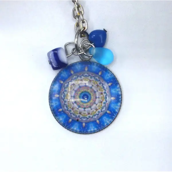 Pendentif rond fleurs bleu en cabochon en verre et acier inoxydable