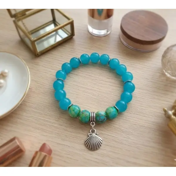 Bracelet fil élastique perles en verre turquoise et breloque