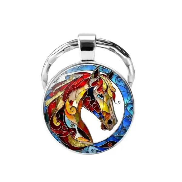 Porte-clés, bijou de sac cabochon tête de cheval multicolore contour bleuté.