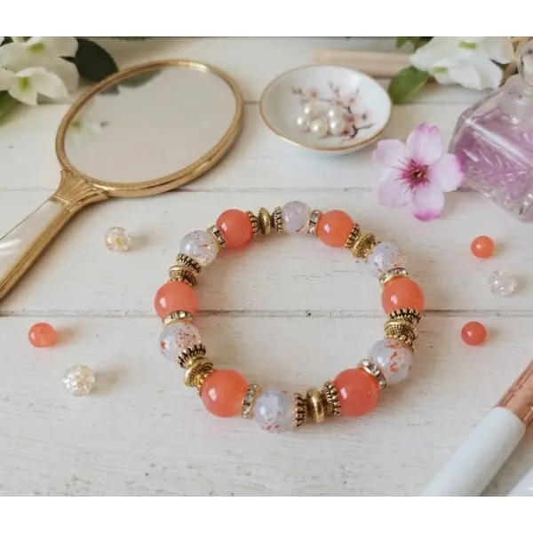 Bracelet fil élastique perles imitation jade et craquelé orange