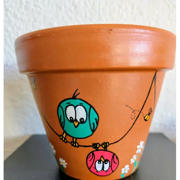 Pot en terre cuite illustration fait-main famille oiseaux