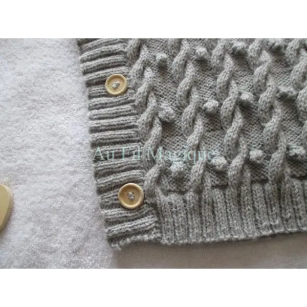 Poncho tricot laine couleur gris clair taille 2 ans