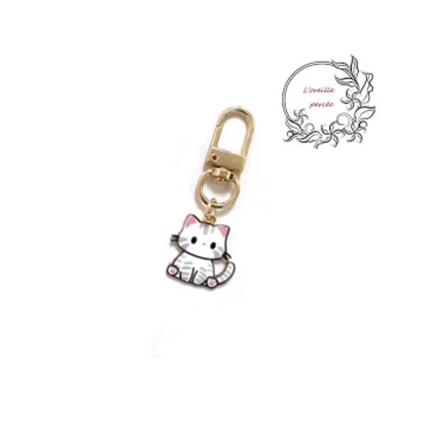 Porte clé chat blanc émail