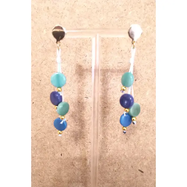 Boucles d'oreilles ivoire végétal bleu/vert , acier inoxydable doré , fil de nylon bleu clair .